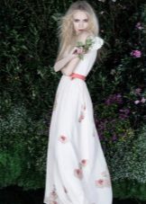 White evening dress with a pink belt