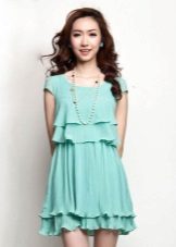 Maikling navy dress na may mga frills sa palda at dibdib