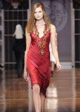 Ruby Jewelery in a Red Sheath Dress