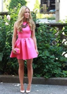 Pink evening gown with a massive necklace