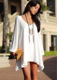 Knitted dress with a free sleeve