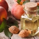 The benefits and harm of peach oil for the face and tips on its use